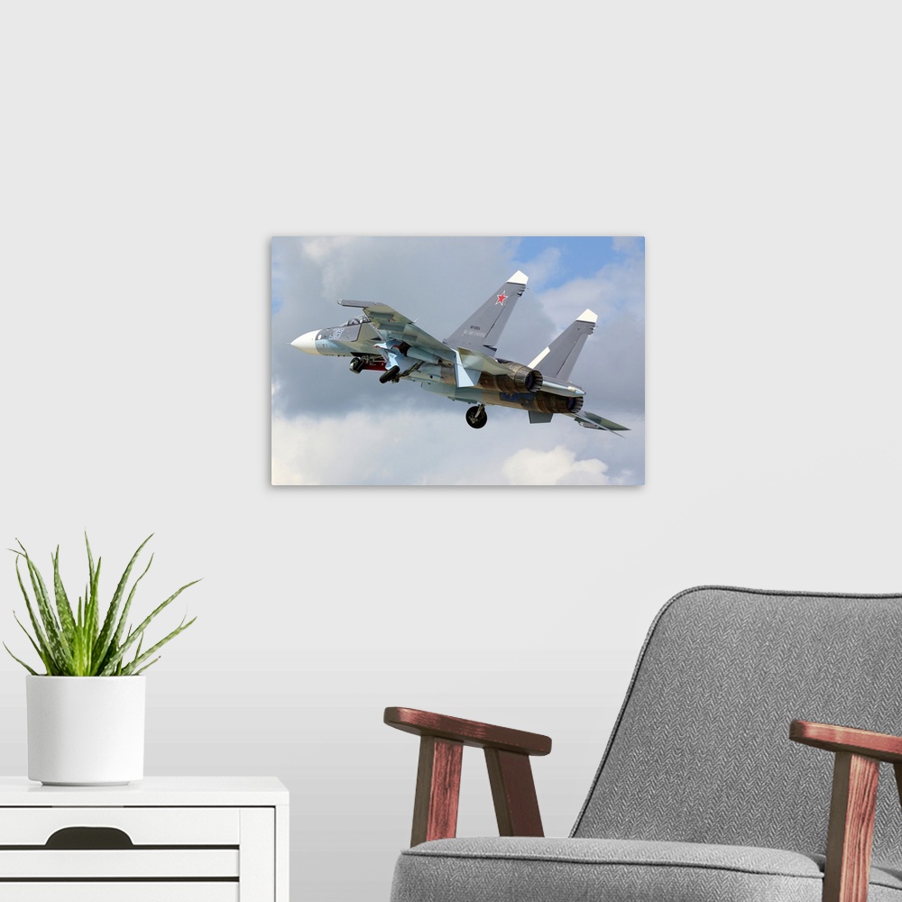 A modern room featuring Su-30SM jet fighter of the Russian Navy taking off.