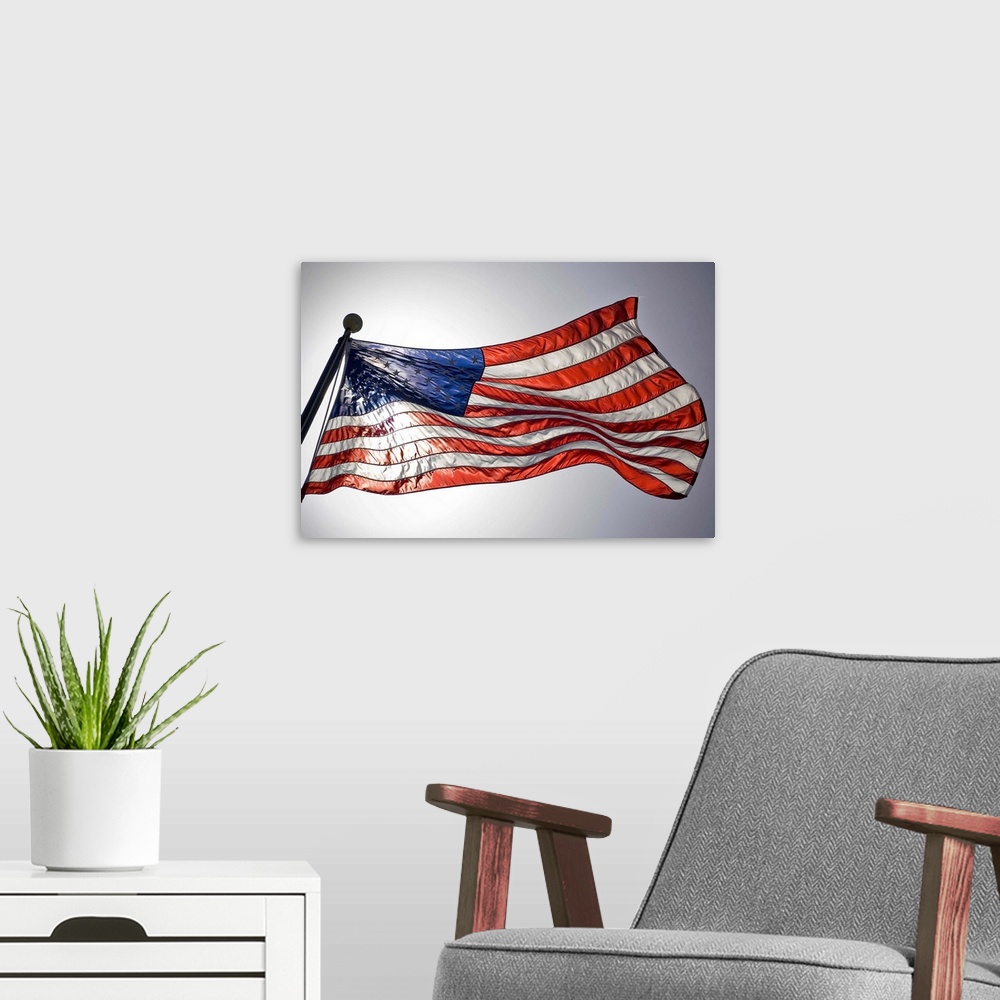 A modern room featuring The American flag flies prominently.