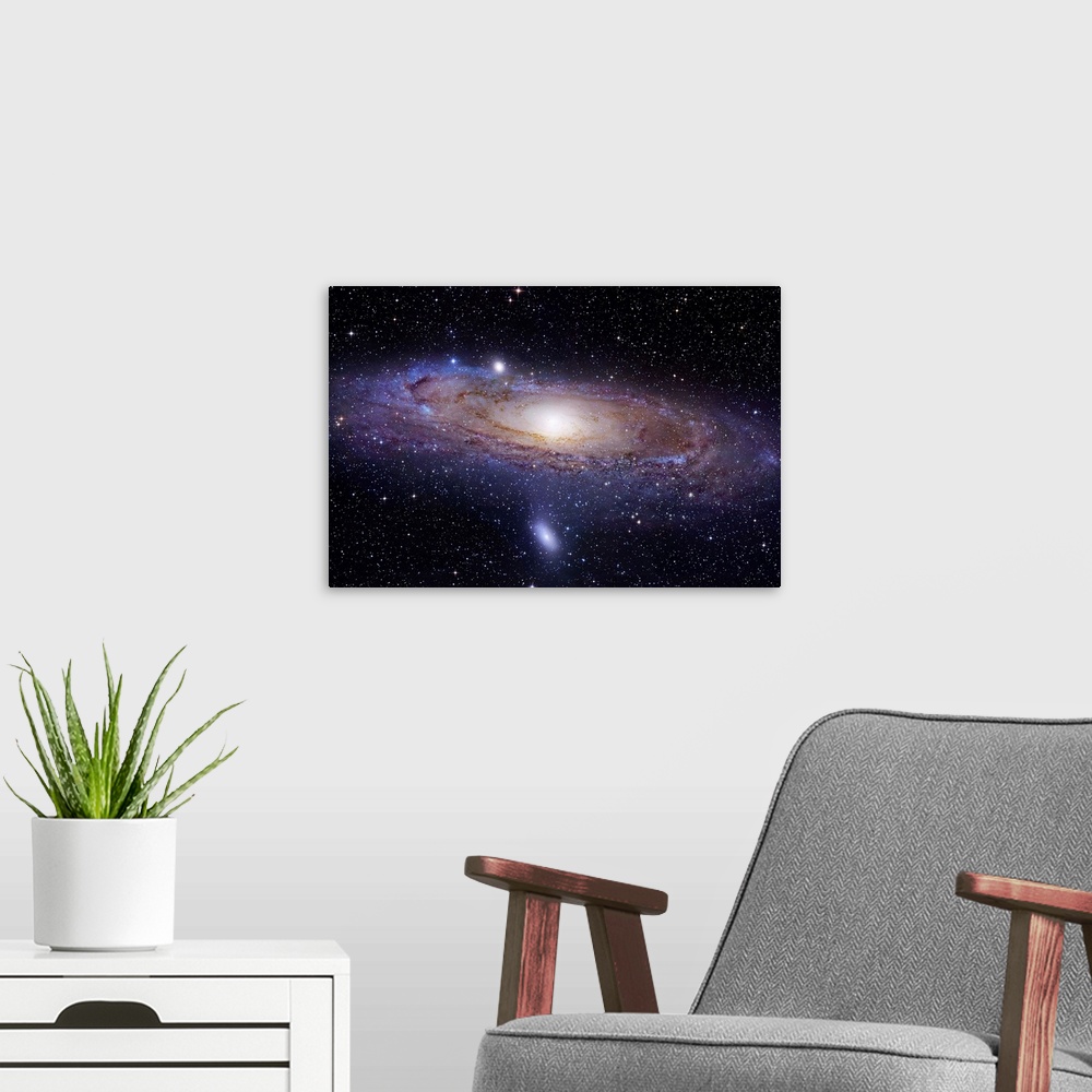 A modern room featuring Landscape photograph of a spiral galaxy 2.5 million light years away.