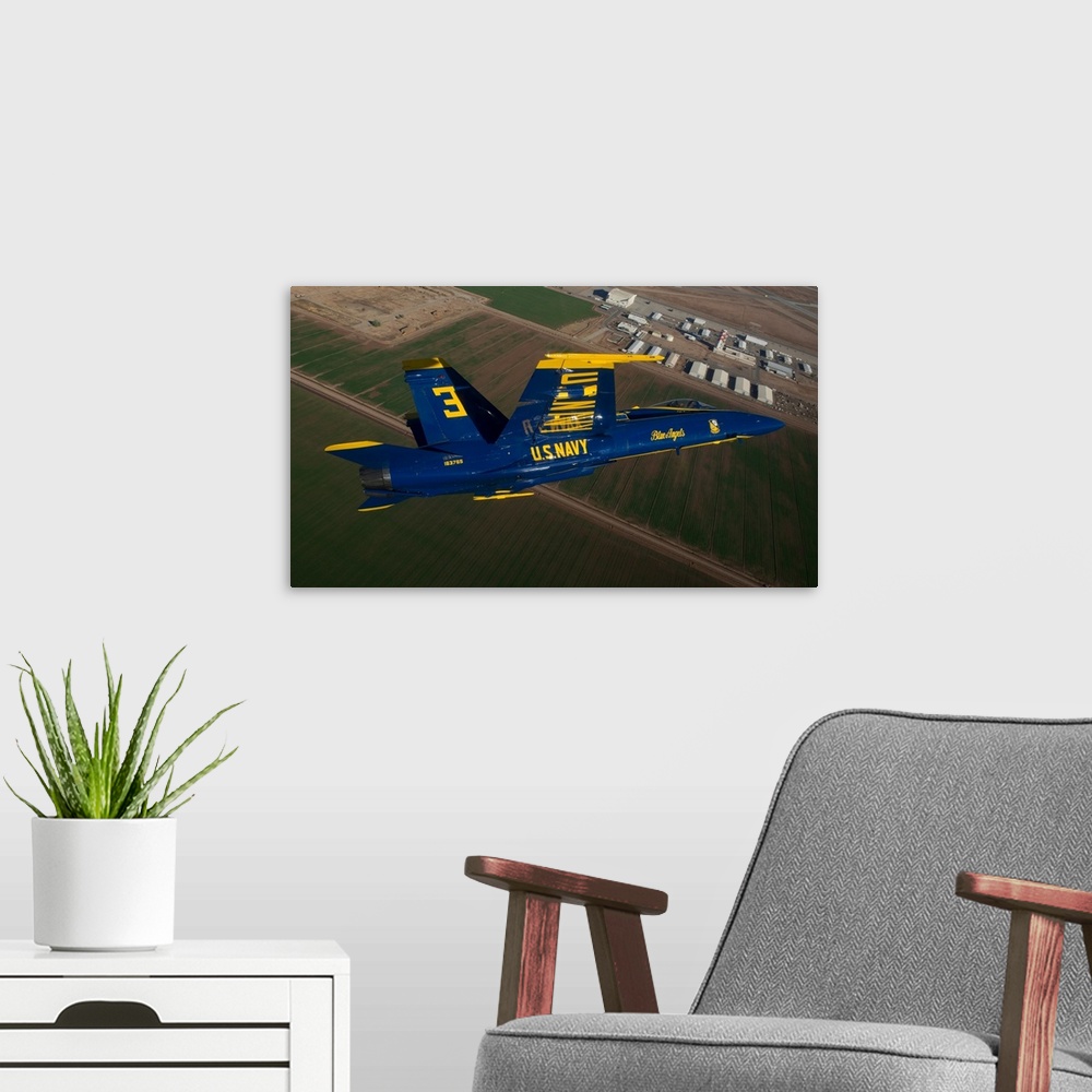 A modern room featuring The Blue Angels perform over El Centro, California.