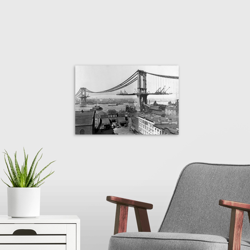 A modern room featuring The construction of the Manhattan Bridge during 1901-1909.