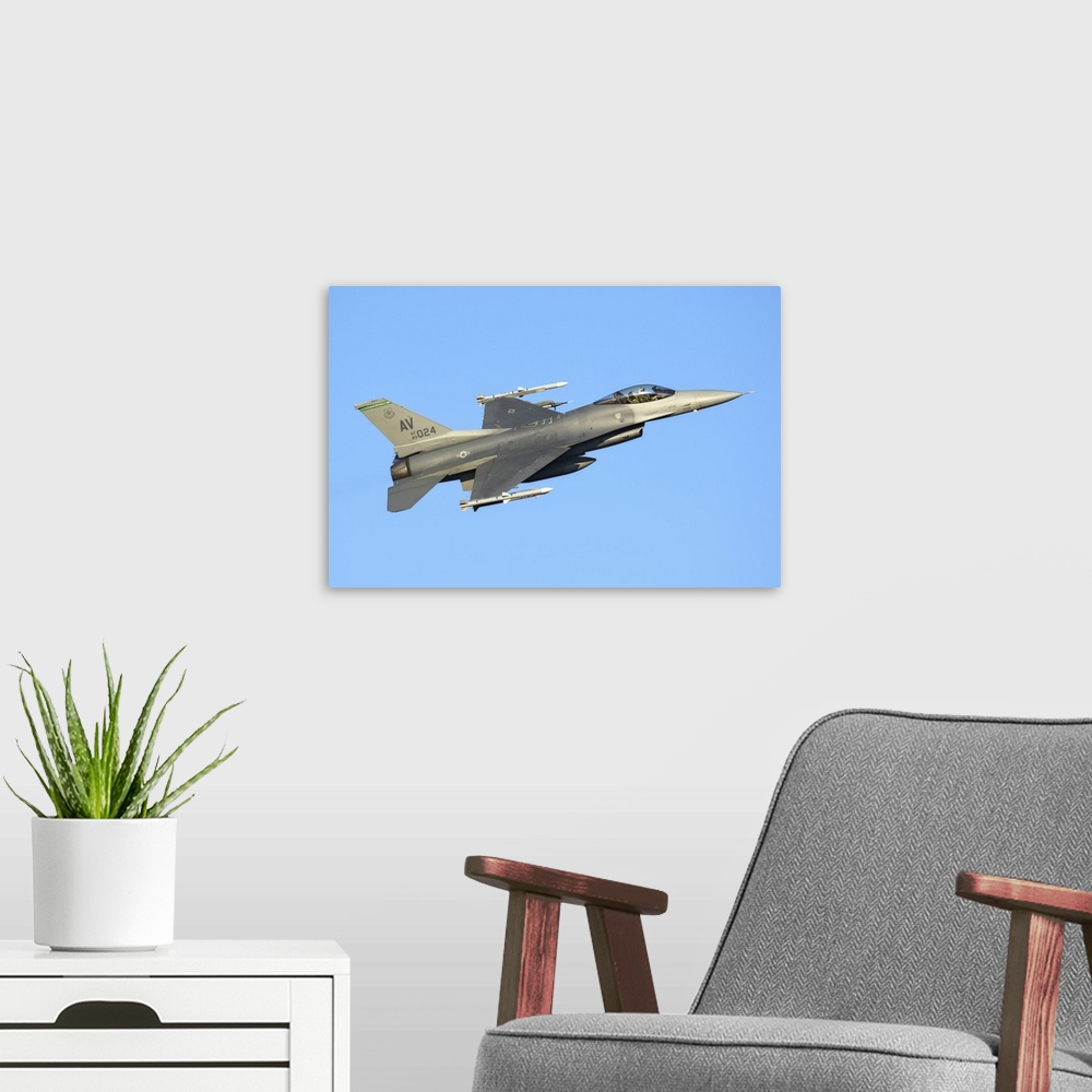 A modern room featuring U.S. Air Force F-16C Block 40 of the 555th Fighter Squadron, 31st Operations Group, takes off fro...