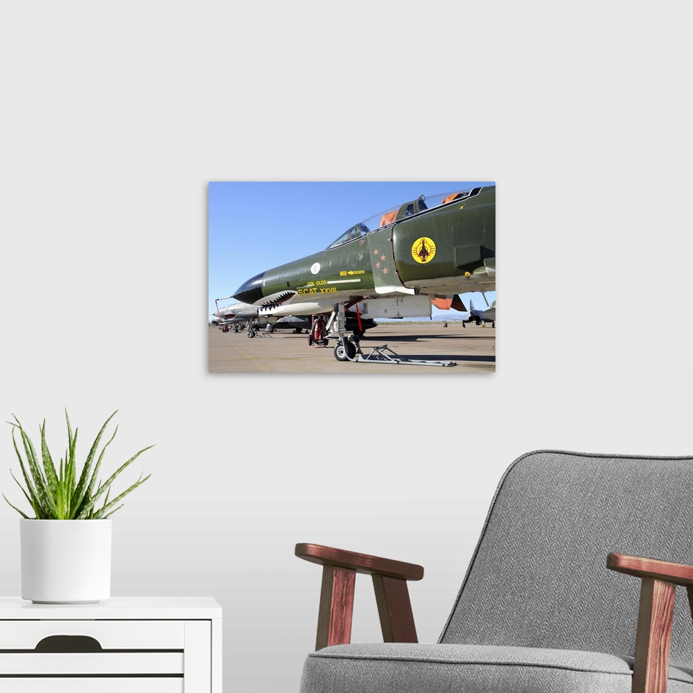 A modern room featuring U.S. Air Force QF-4 Phantom II with Sharkmouth of 82nd ATS, on the ramp at Holloman Air Force Bas...