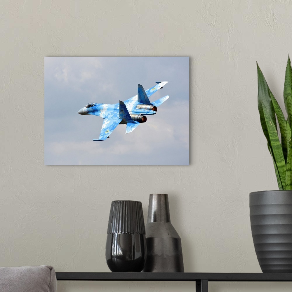 A modern room featuring Ukraine Air Force Su-27 taking off.