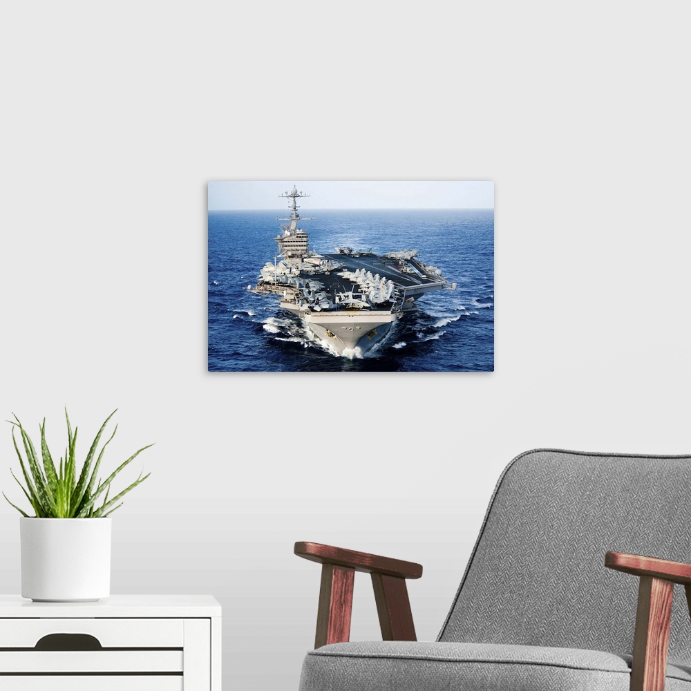 A modern room featuring USS John C. Stennis transits the Pacific Ocean.
