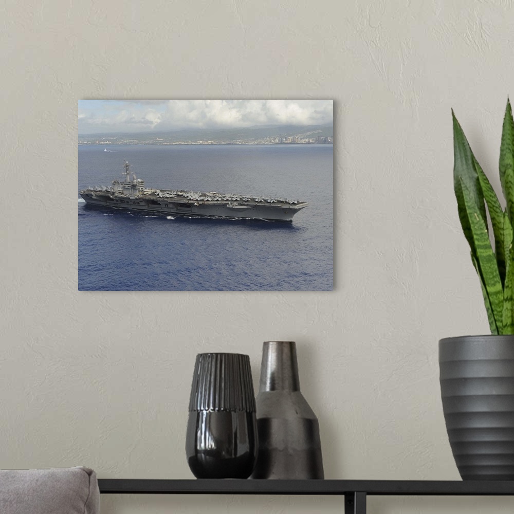 A modern room featuring USS Theodore Roosevelt departs from Joint Base Pearl Harbor-Hickam, Hawaii.