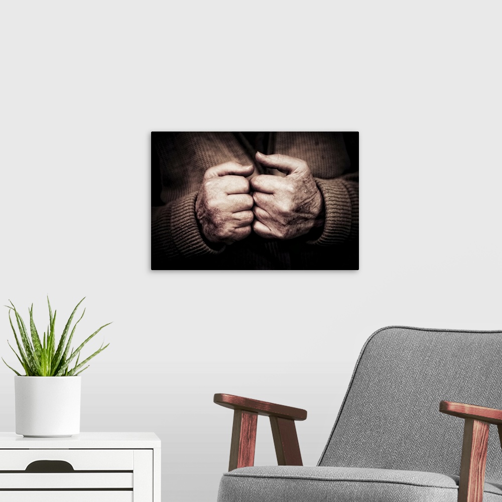 A modern room featuring Old man's hands