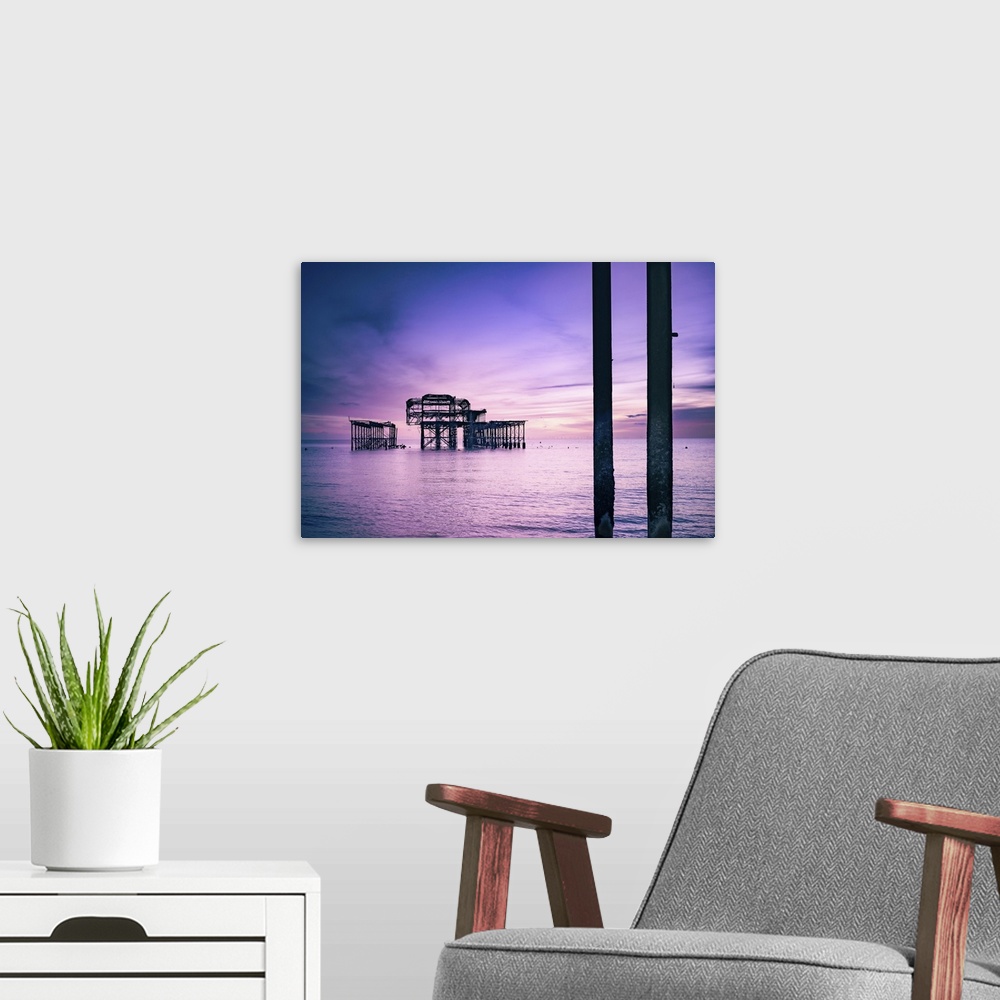 A modern room featuring Brighton is a seaside town in the south of England, UK. Dusk on the beach. The West Pier is a pie...