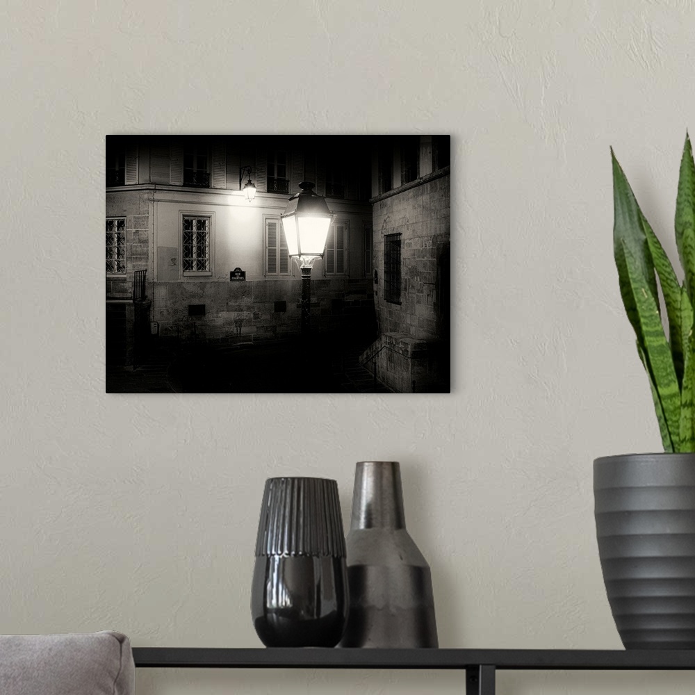 A modern room featuring Paris back street at night with street light