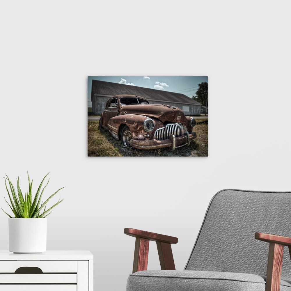 A modern room featuring Rusty 1942 Buick