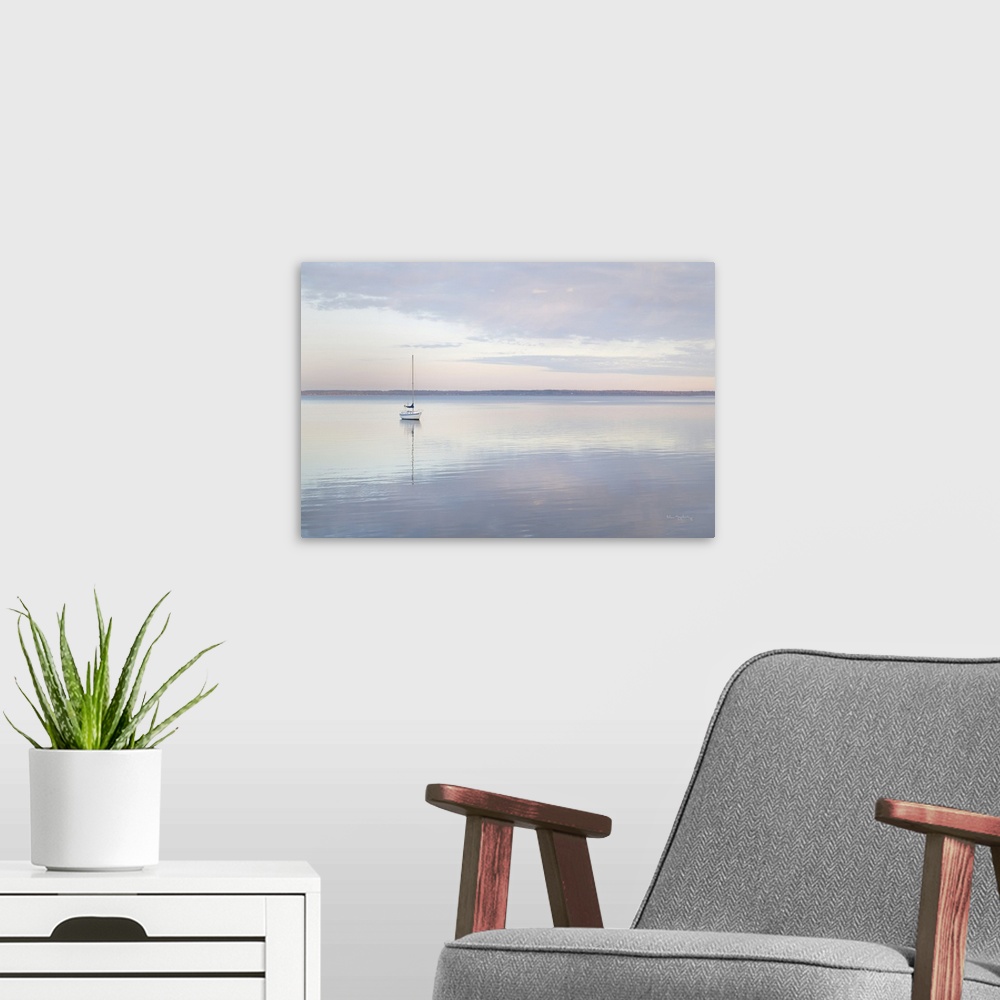 A modern room featuring Sailboat and morning clouds reflected in calm waters of Bellingham Bay Washington.