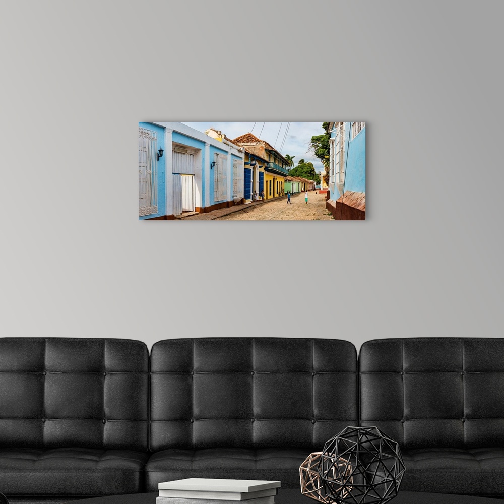 A modern room featuring Colorful houses on the cobblestone street, Trinidad, Cuba