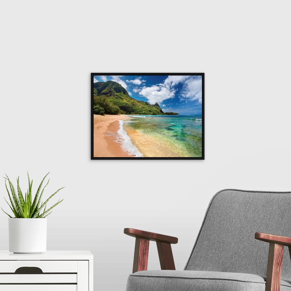 A modern room featuring Big photograph shows the clear waters of the Pacific Ocean slowly making their way to the sandy s...