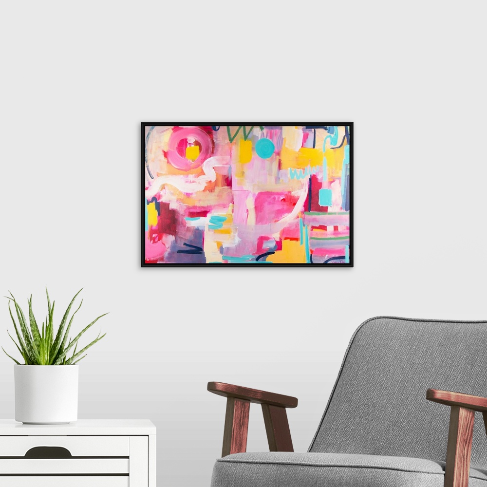 A modern room featuring Contemporary artwork in pink, yellow, and turquoise.