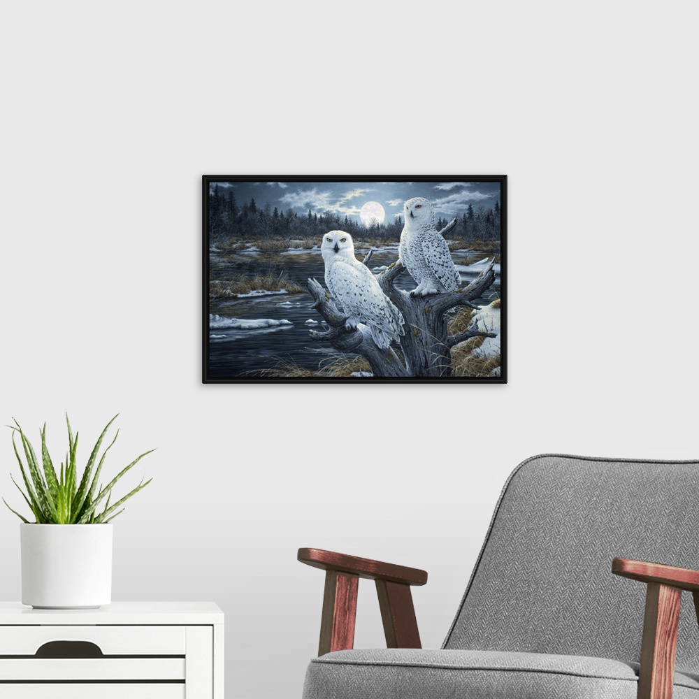 A modern room featuring a pair of white owls perched in the top of a dead tree with the moon rising in the background