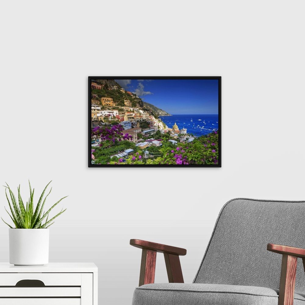 A modern room featuring Italy, Campania, Amalfi Coast, Positano, Positano village at sunset