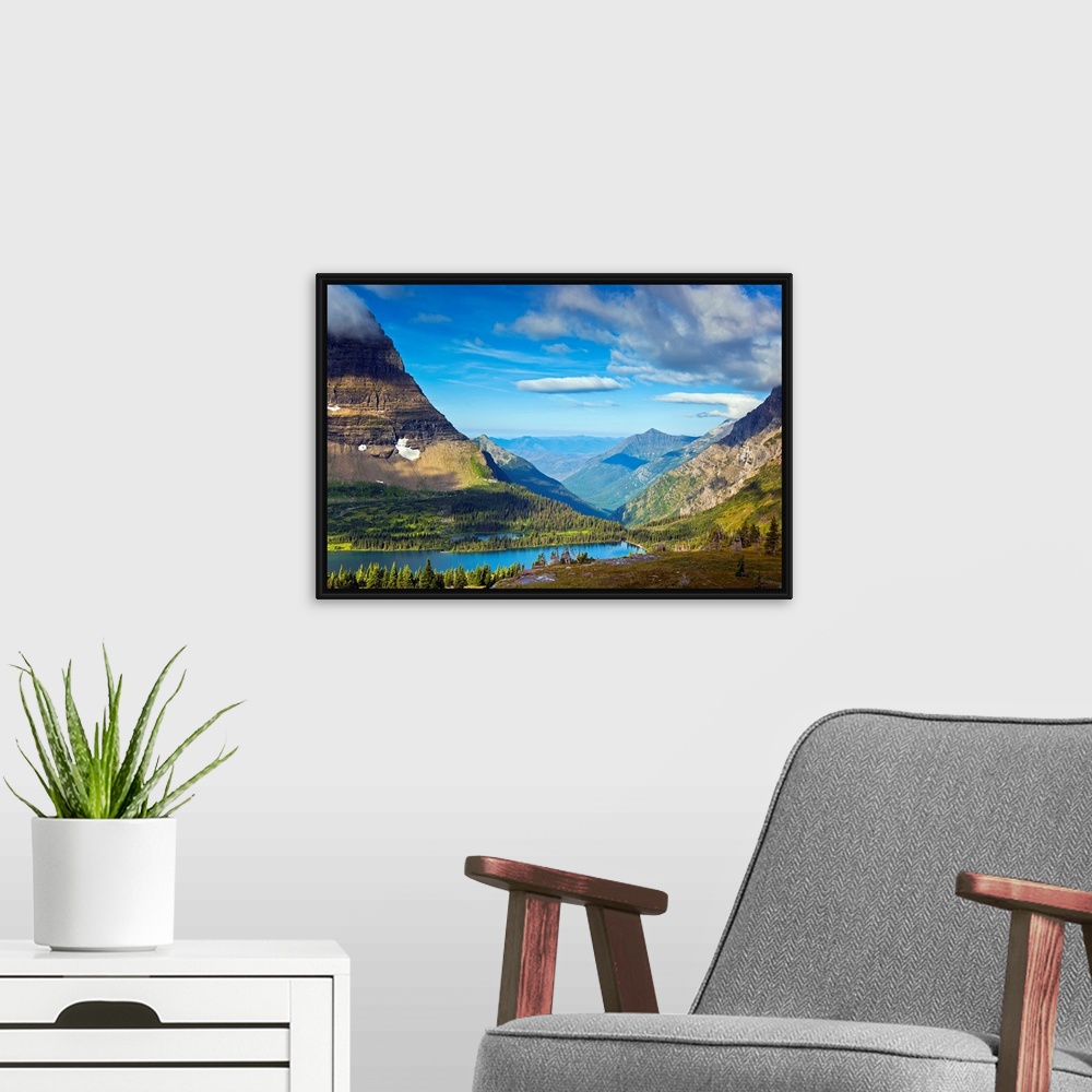 A modern room featuring Large, landscape photograph of  Hidden Lake from an overlook, surrounded by mountains in Glacier ...