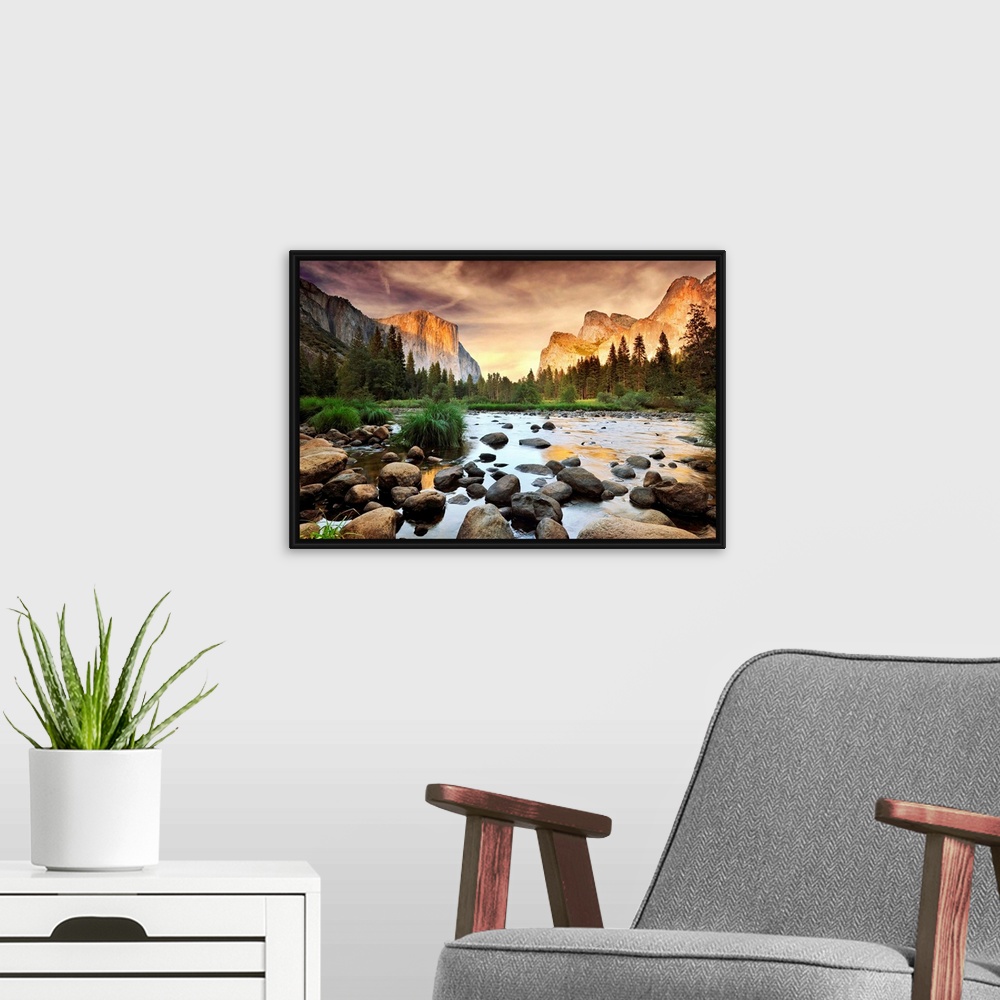 A modern room featuring A landscape photograph taken from the valley floor of this national park as the sun illuminates t...