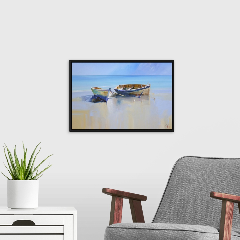 A modern room featuring Painting of two beached rowboats at low tide.