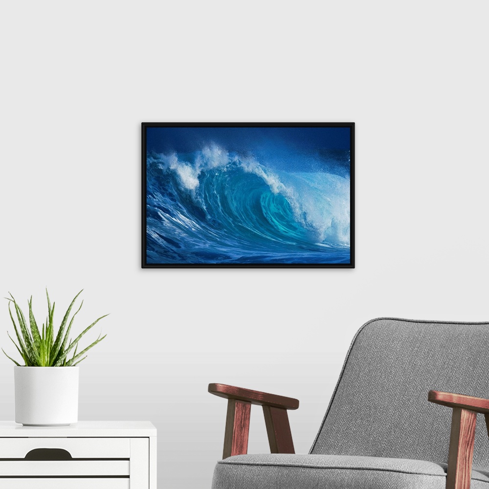A modern room featuring A close up horizontal photograph of a curling wave. During late November through mid-January, the...