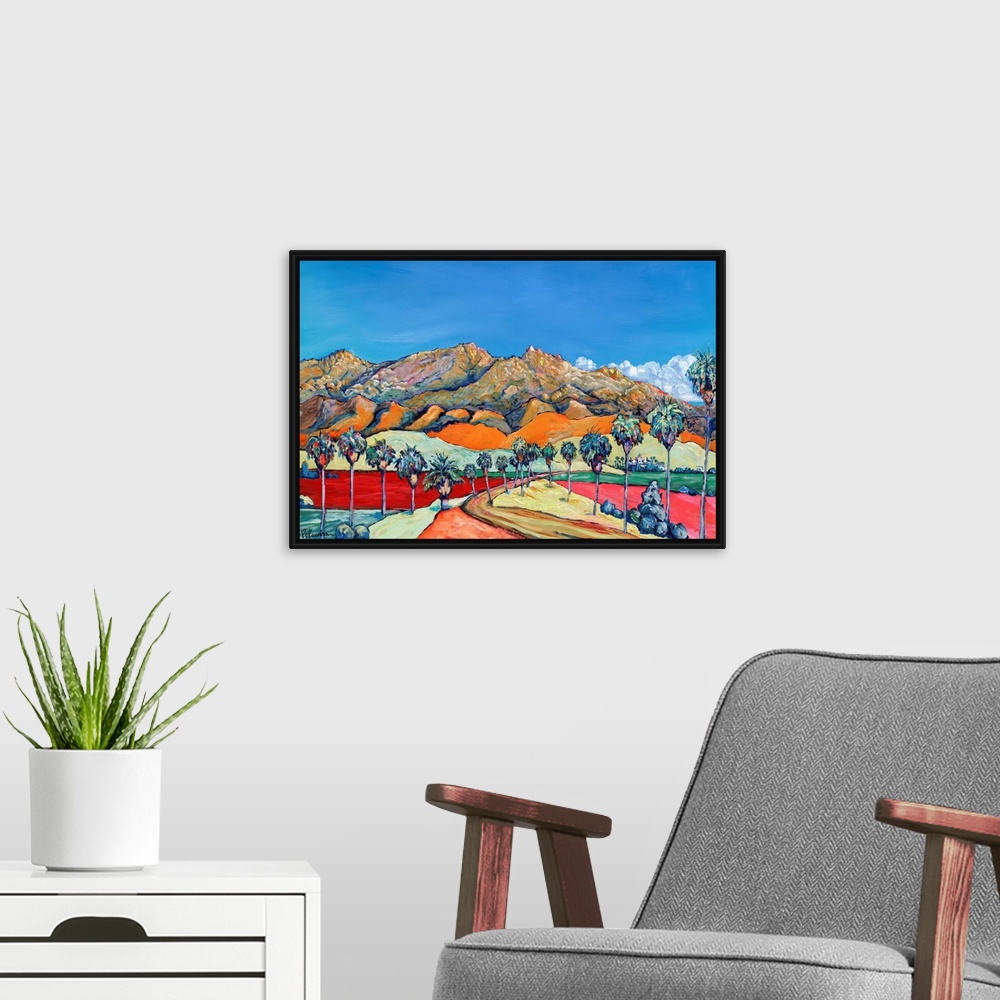 A modern room featuring San Diego desert in exciting bright and bold colors. Blue skies and swaths of color, rugged mount...