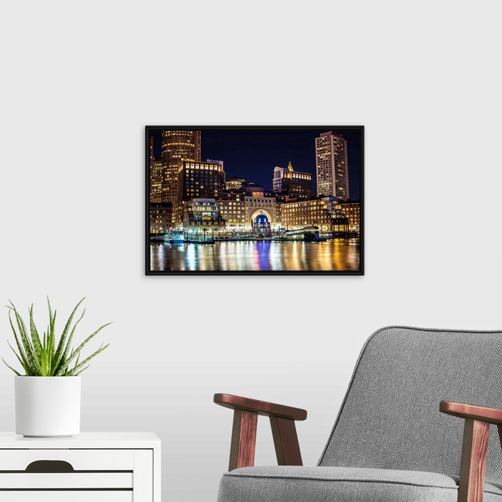A modern room featuring View of Boston city skyscrapers and the Marina at Rowes Wharf.