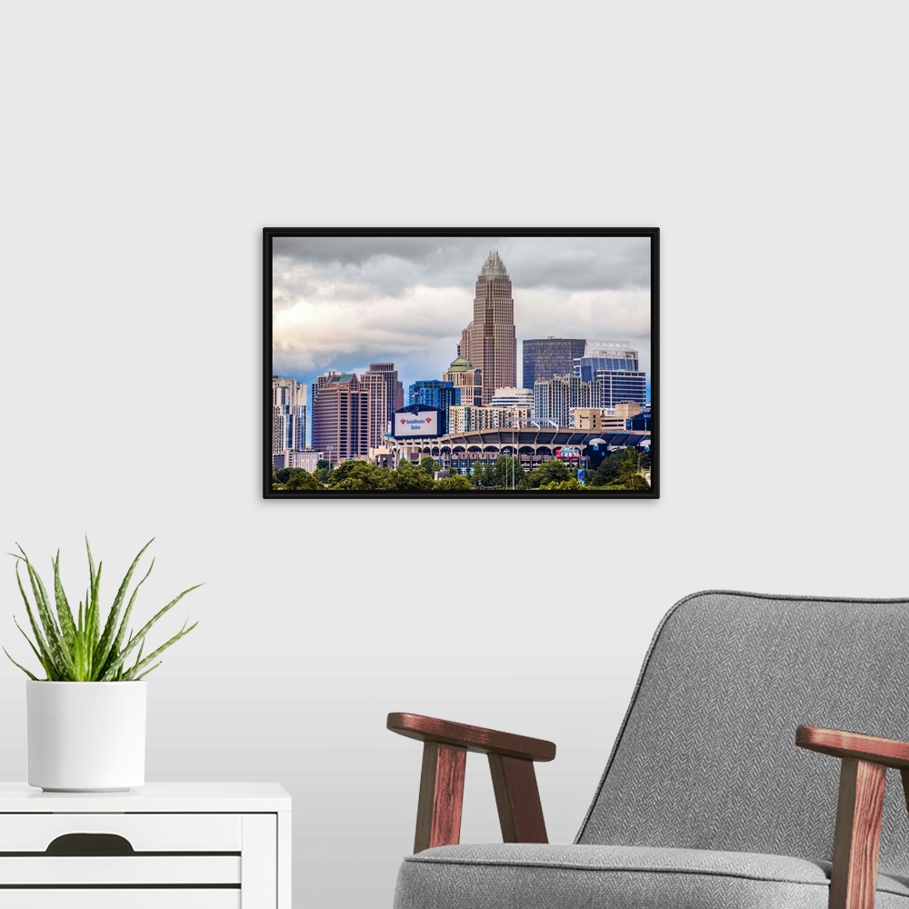 A modern room featuring Horizontal image of the city of Charlotte, North Carolina with a cloudy sky.