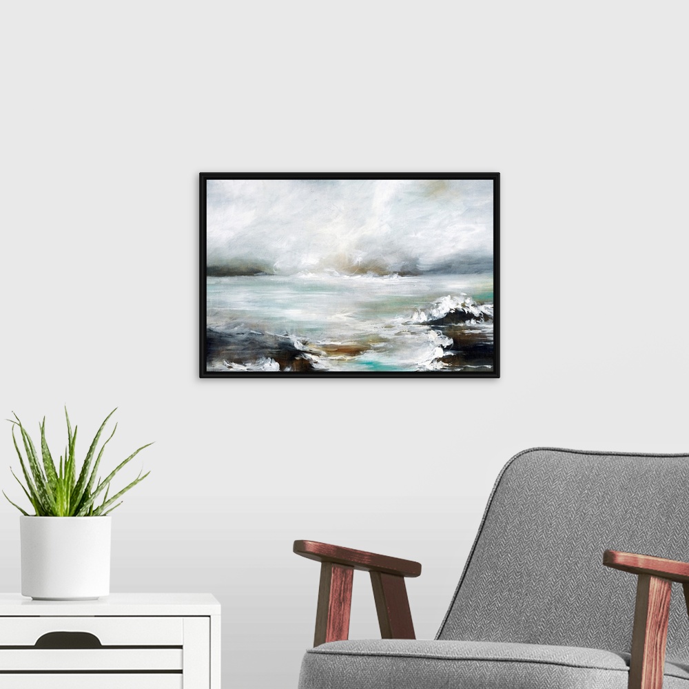 A modern room featuring Contemporary artwork of a seascape with mild waves on a cloudy day.