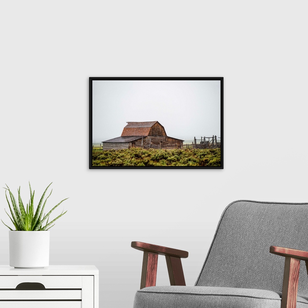 A modern room featuring View of the John Moulton Barn with fog rolling in, Grand Teton National Park, Wyoming.