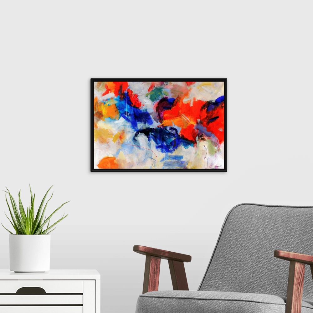 A modern room featuring Wall art of an abstractly painted canvas of different blotches of bright colors put together.