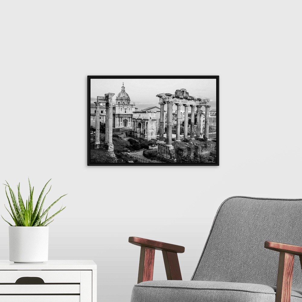 A modern room featuring Black and White photograph of the ruins at the Roman Forum.
