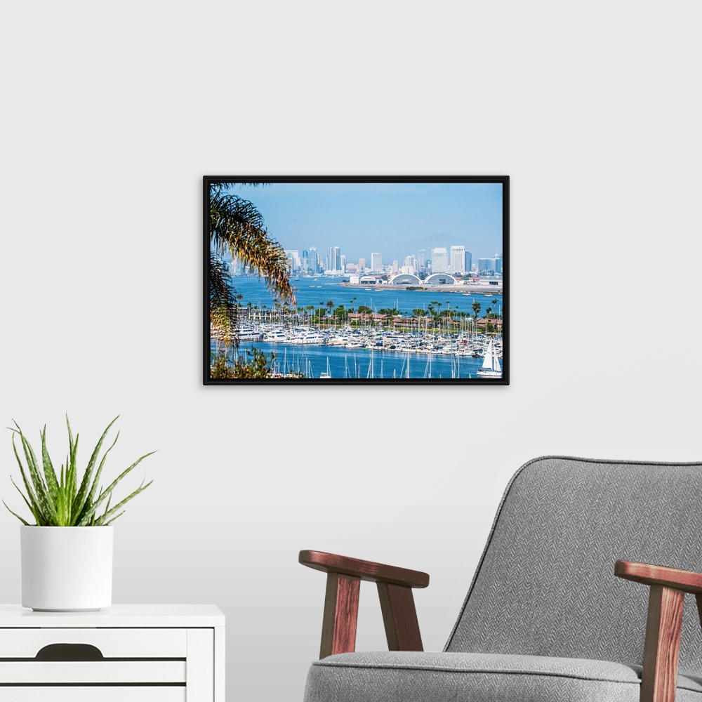 A modern room featuring Panoramic photograph of the San Diego, California skyline with a marina in the foreground packed ...