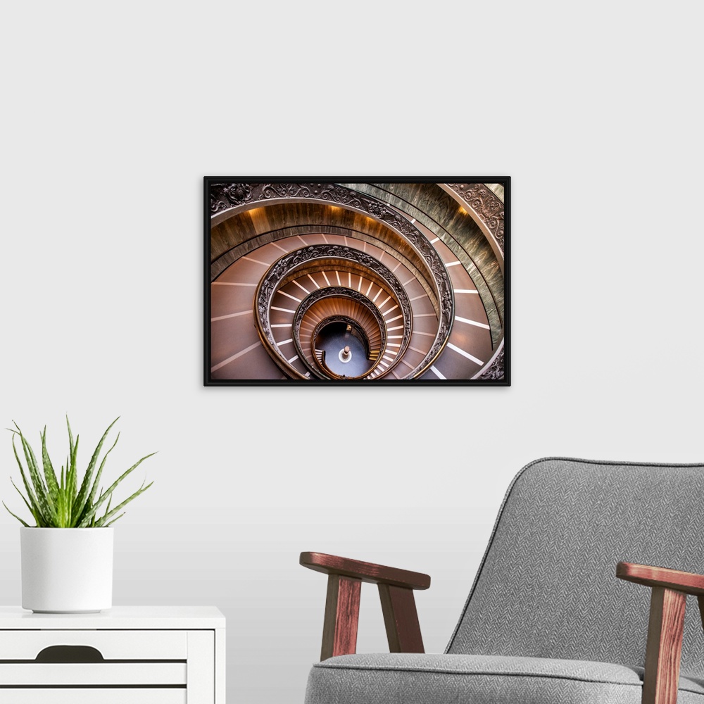 A modern room featuring Photograph of the spiral staircase at the Vatican Historical Museum.