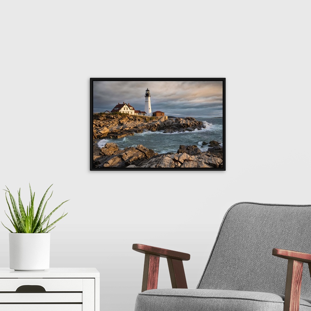 A modern room featuring Portland Maine Lighthouse at sunrise.