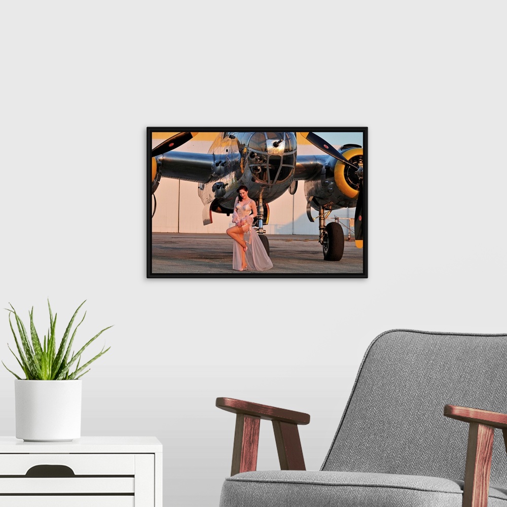 A modern room featuring Sexy 1940's pin-up girl in lingerie posing with a B-25 bomber.