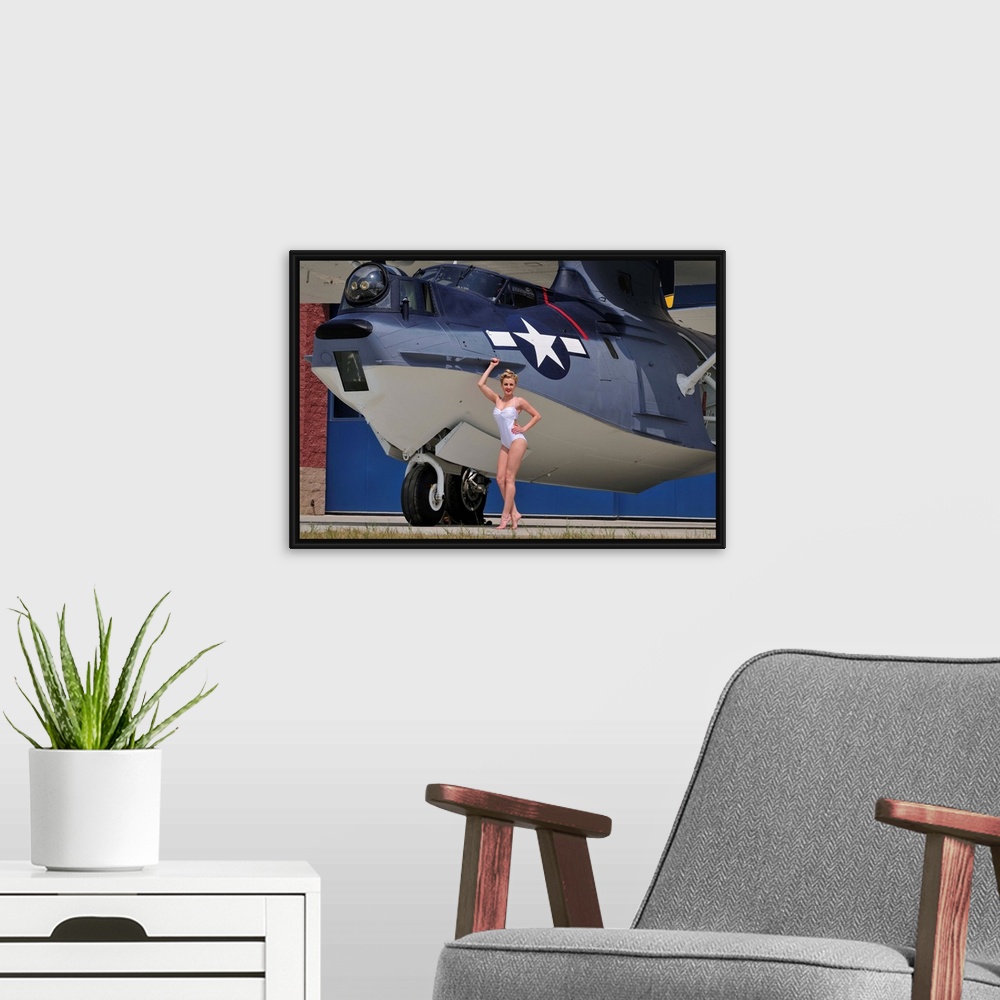 A modern room featuring Retro pin-up girl posing with a World War II era PBY Catalina seaplane.