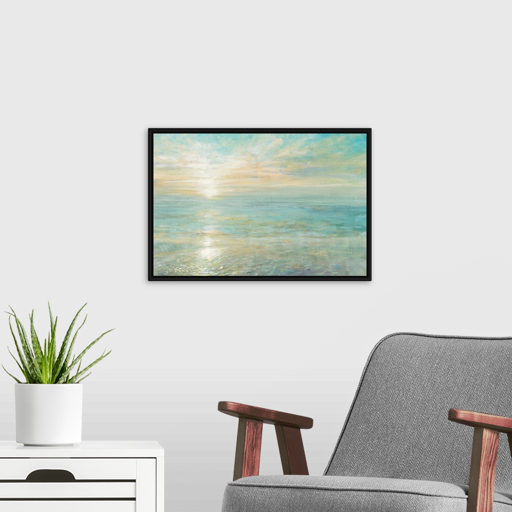A modern room featuring Contemporary artwork of the sun rising over a calm ocean.