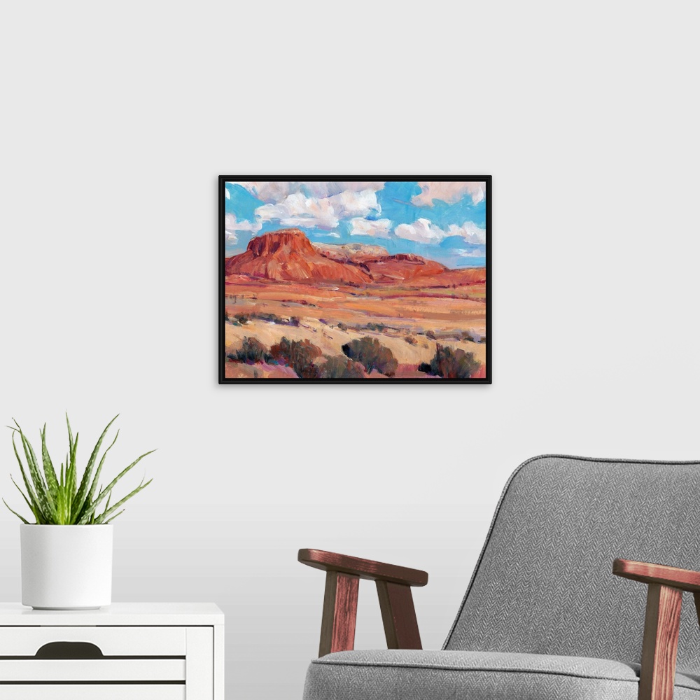 A modern room featuring Contemporary landscape painting of a bright blue cloudy sky overlooking a desert.