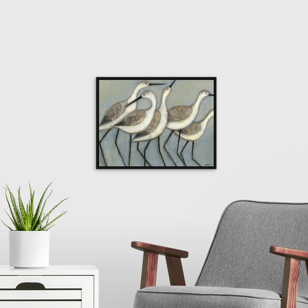 A modern room featuring A group of wader birds stand next to each other against a cool toned background.