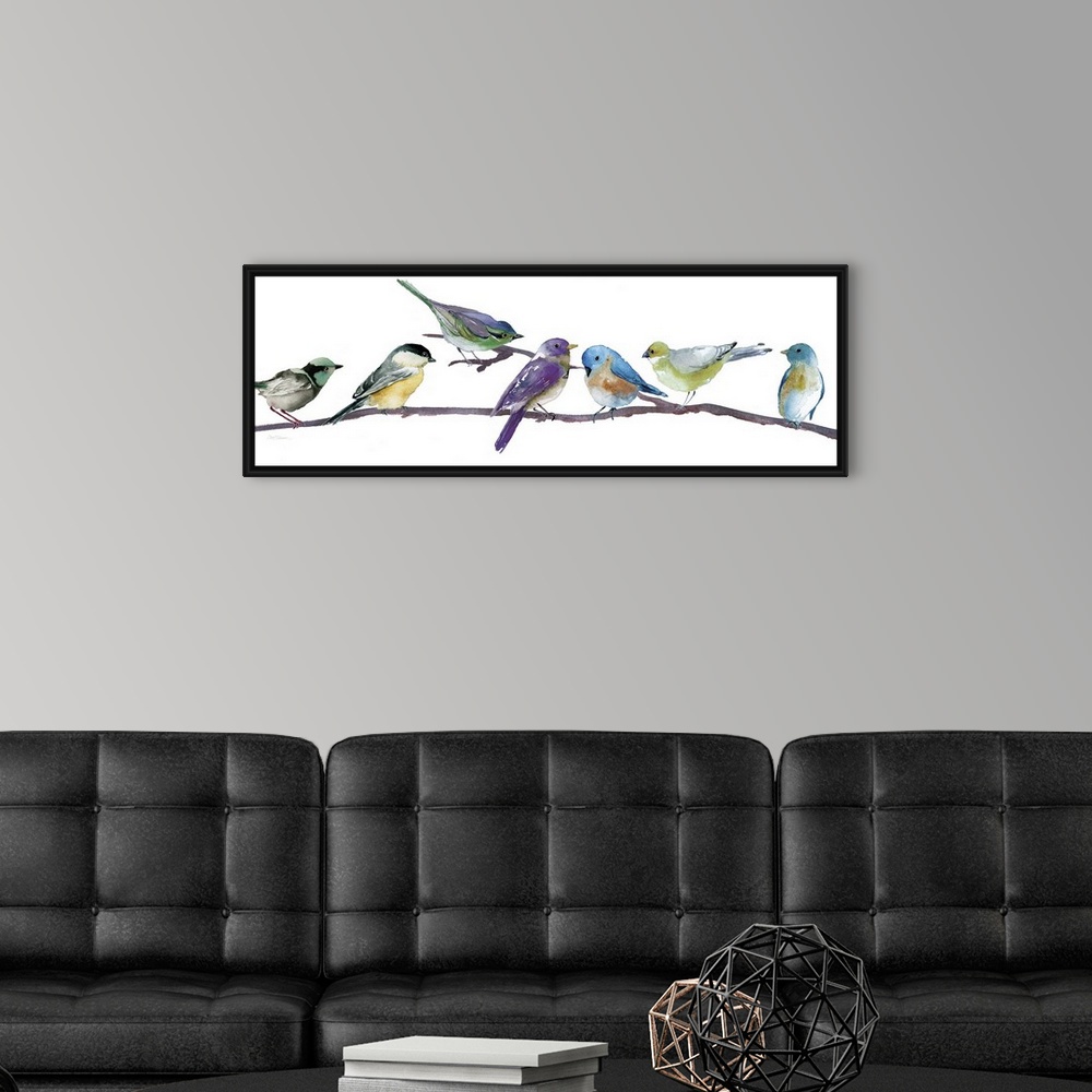 A modern room featuring Brightly colored songbirds perched in a row on a branch.