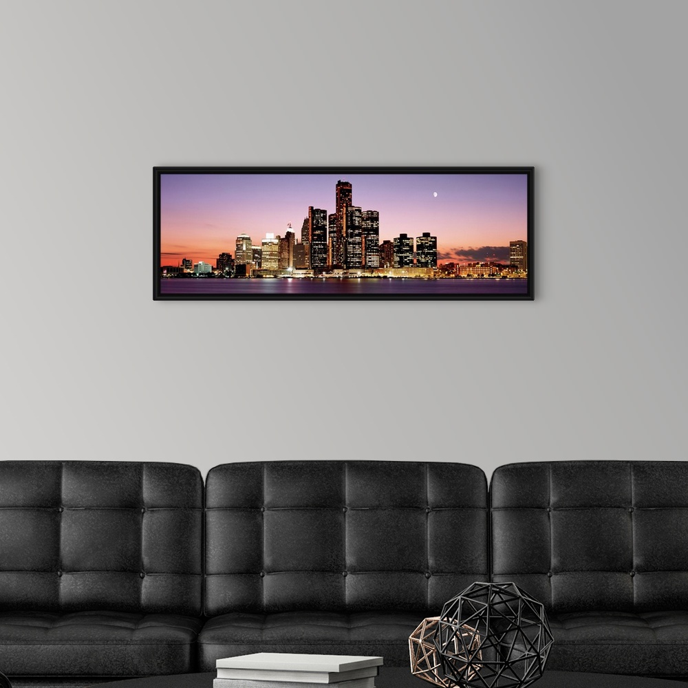 A modern room featuring Panoramic skyline of downtown Detroit at sundown.