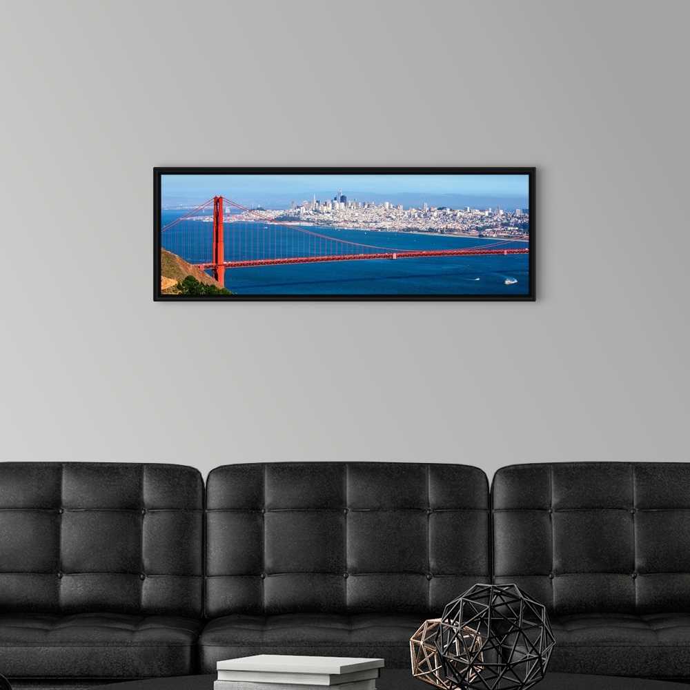 A modern room featuring Panoramic photograph of the Golden Gate Bridge with San Francisco's skyscrapers in the background.