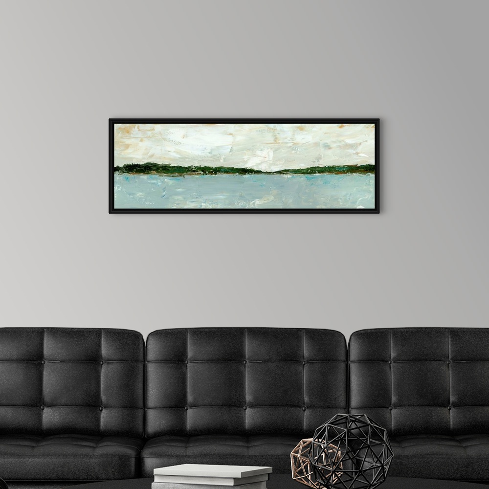 A modern room featuring A long, panoramic abstract of a lake or ocean scene, with stormy blue waters under a cloudy sky. ...