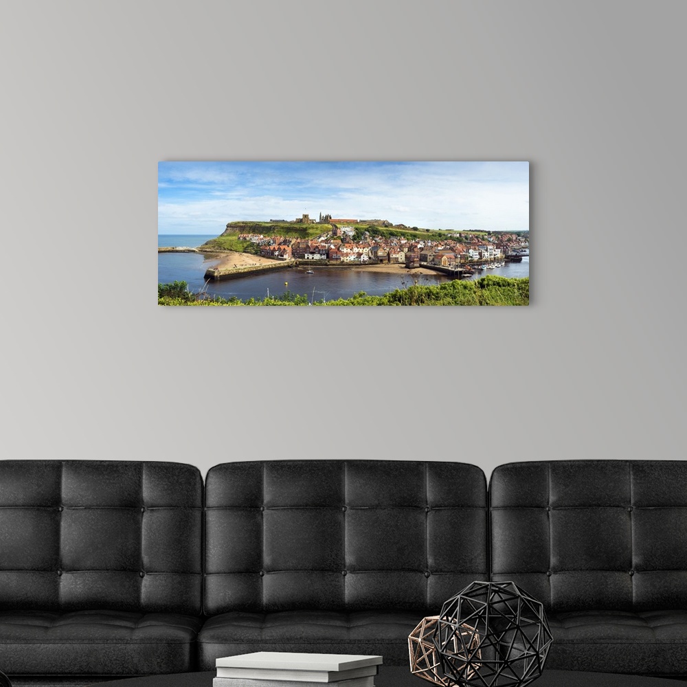 A modern room featuring United Kingdom, UK, England, Great Britain, North Yorkshire, Whitby, View across the town and har...