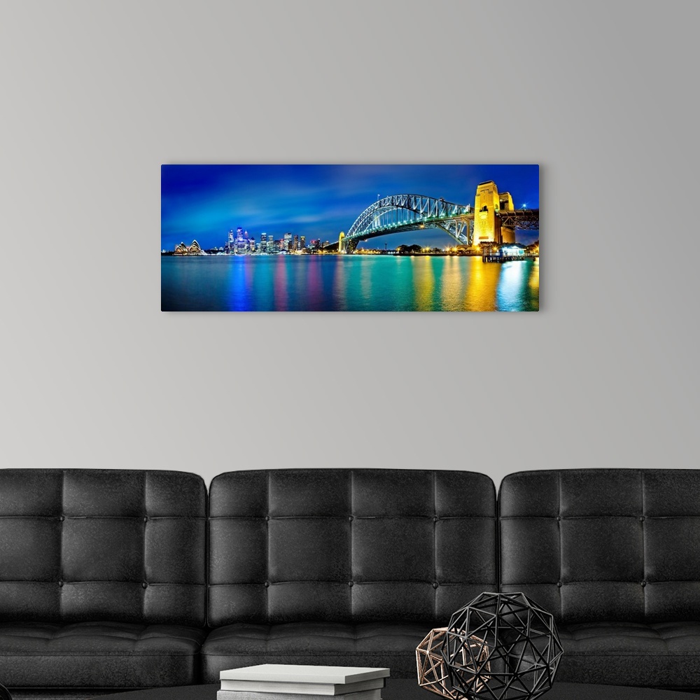 A modern room featuring Sydney Harbour Bridge and skylines at night, Sydney, New South Wales, Australia.