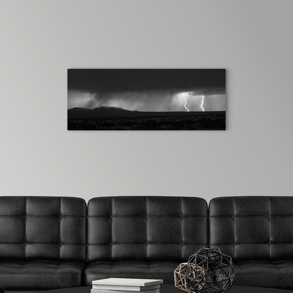 A modern room featuring Lightning storm over northern New Mexico plains