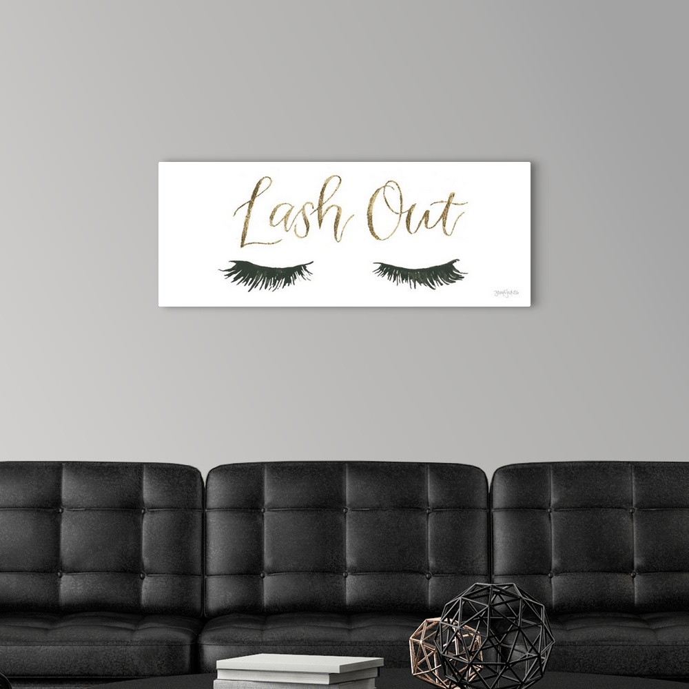 A modern room featuring Decorative artwork of a pair of feminine eyelashes and the text "Lash Out" in gold.