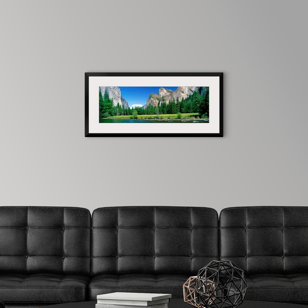 A modern room featuring Wall art for the home or office a panoramic landscape photograph of a river and meadow in the Yos...