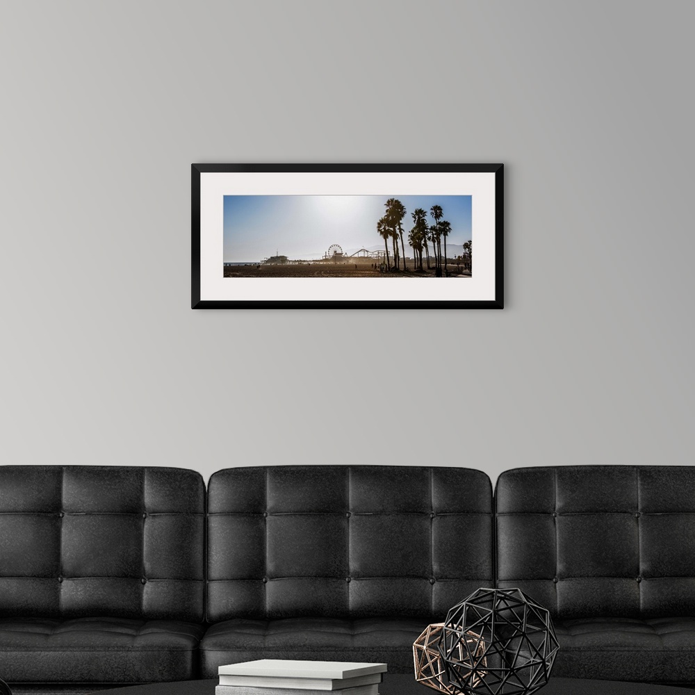 A modern room featuring Panoramic photograph of the Santa Monica Pier in Los Angeles, California, with palm trees in the ...