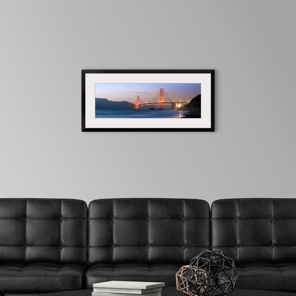 A modern room featuring Panoramic photograph at twilight of the Golden Gate Bridge taken from the shore.